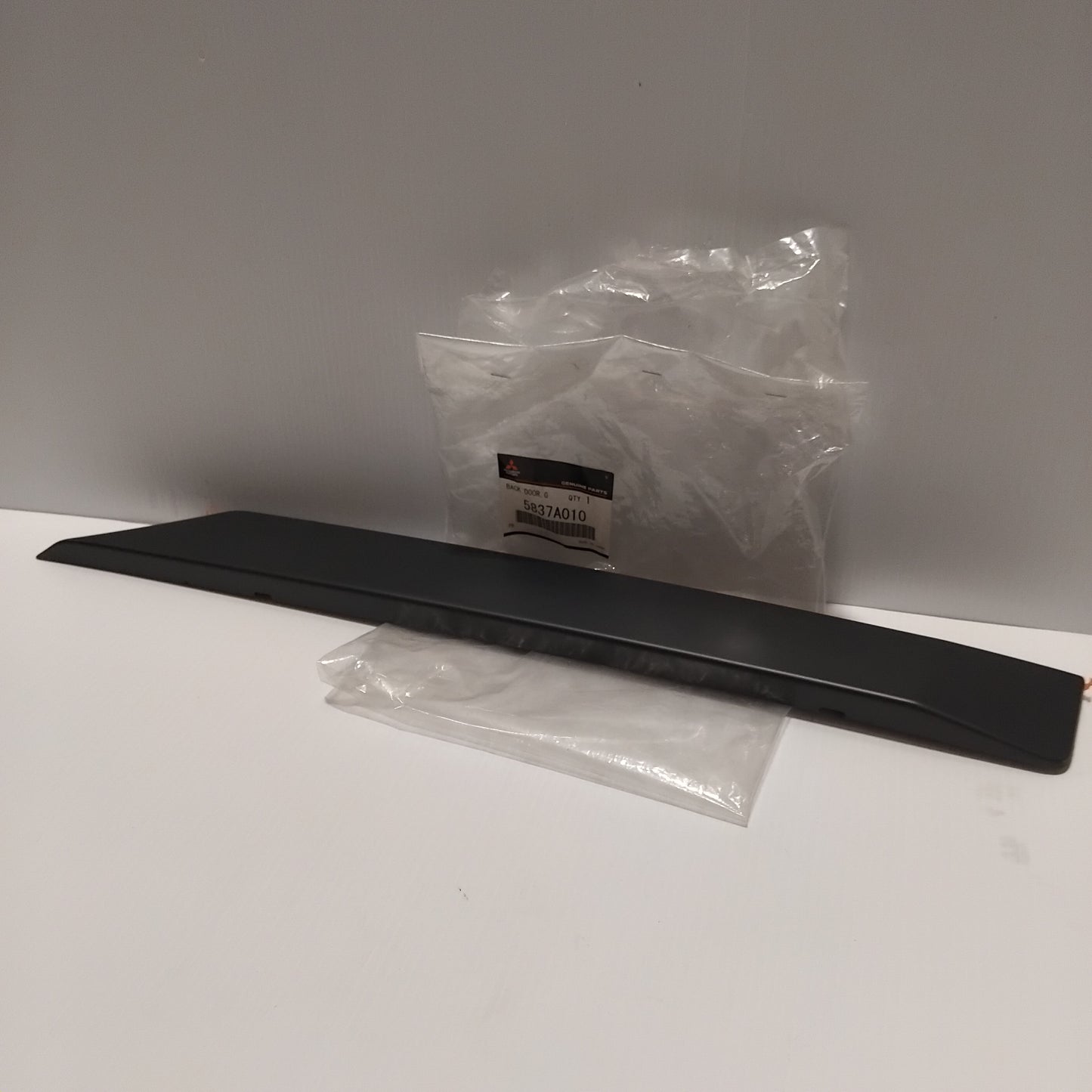 Genuine Mitsubishi Garnish,Back Door,Lwr Rh | 5837A010