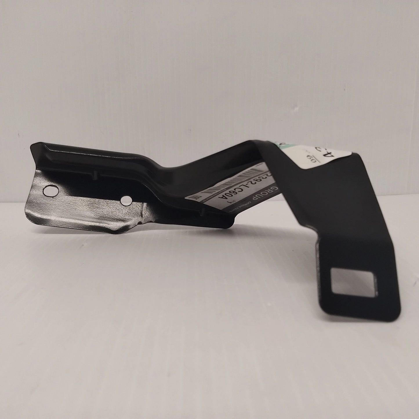 Genuine Front Grille Centre Bracket - Nissan Cabstar 2013-2019 | 62392LC60A