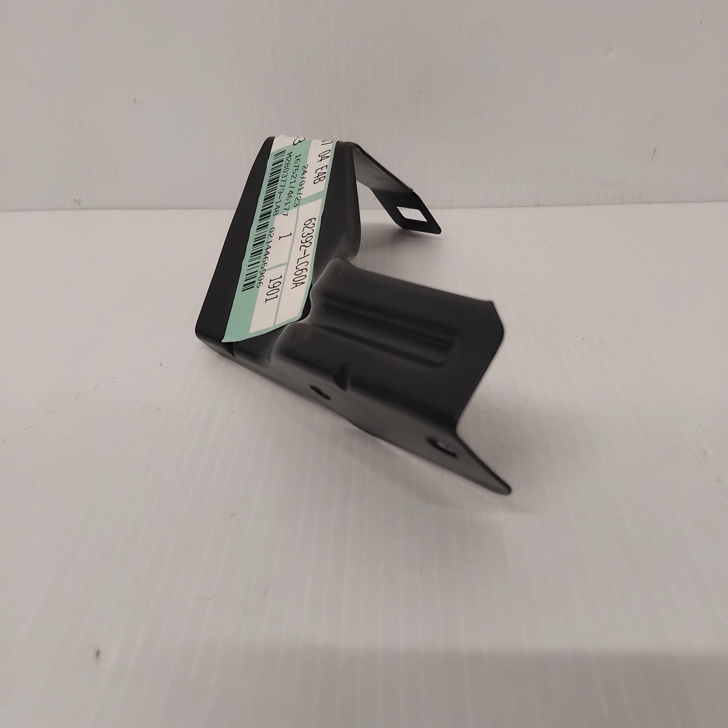 Genuine Front Grille Centre Bracket - Nissan Cabstar 2013-2019 | 62392LC60A