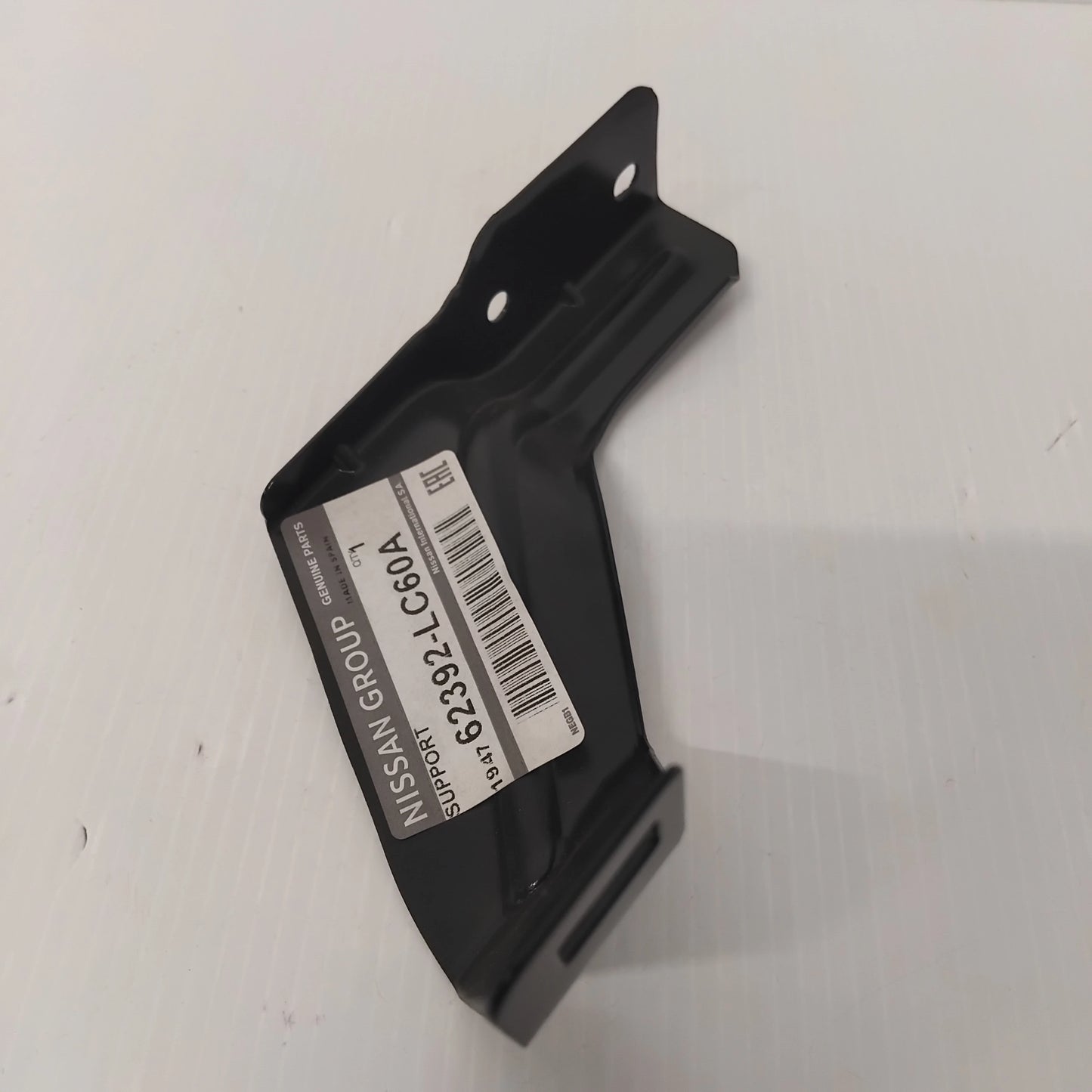 Genuine Front Grille Centre Bracket - Nissan Cabstar 2013-2019 | 62392LC60A