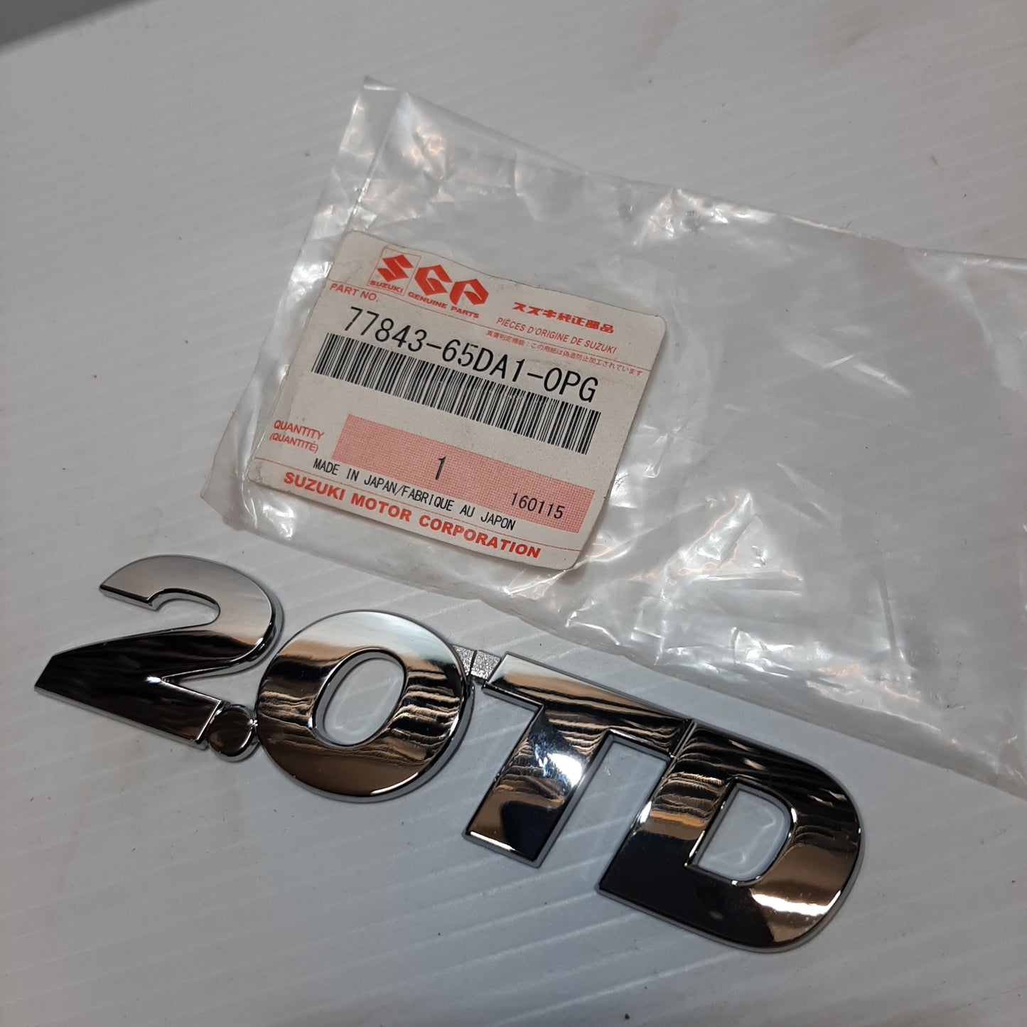 Genuine Emblem 2.O TD - Suzuki Grand Vitara | 77843-65DA1-0PG