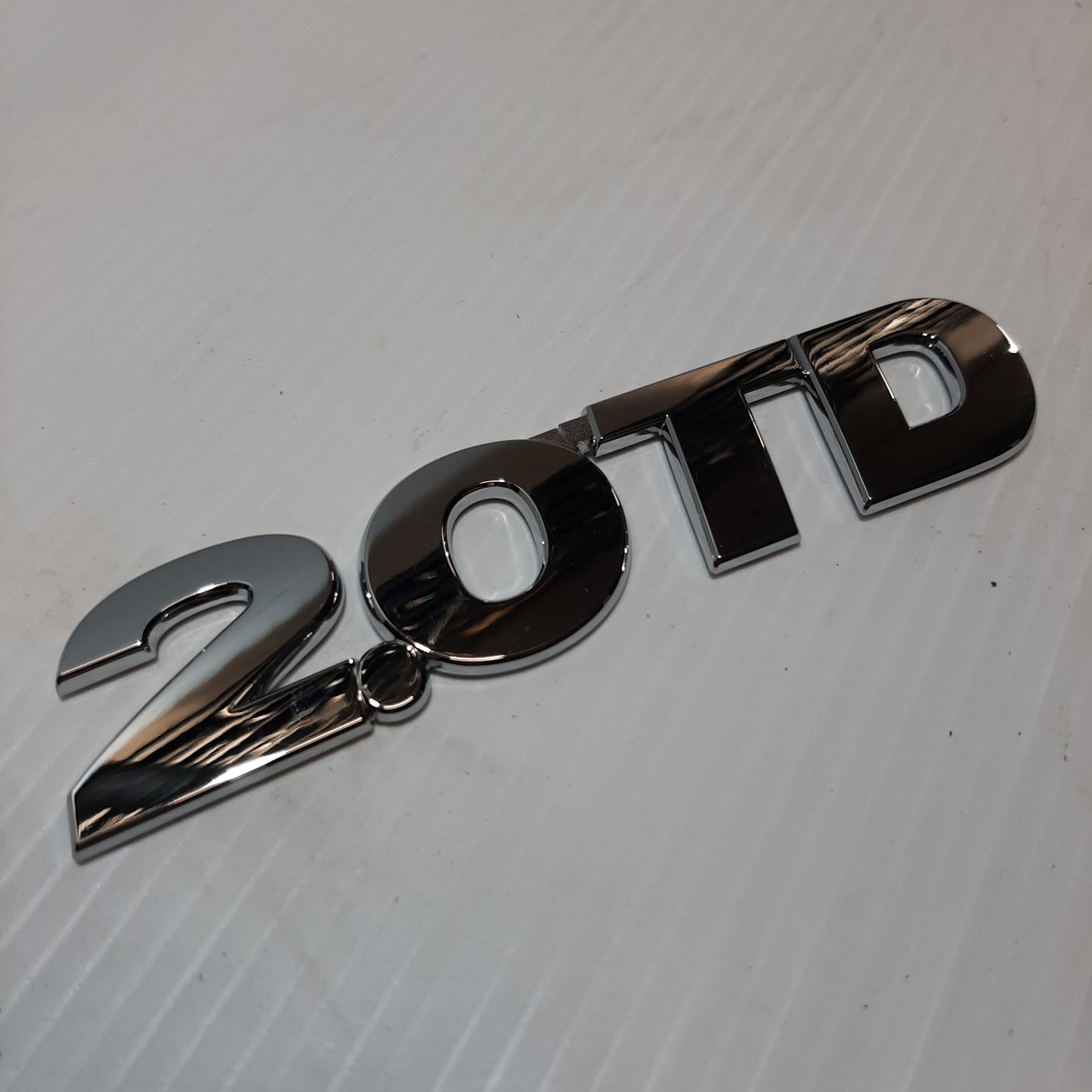 Genuine Emblem 2.O TD - Suzuki Grand Vitara | 77843-65DA1-0PG