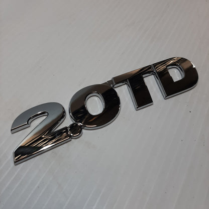 Genuine Emblem 2.O TD - Suzuki Grand Vitara | 77843-65DA1-0PG