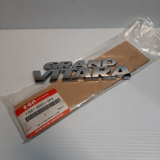 Genuine Emblem Grand Vitara - Suzuki Grand Vitara | 77841-65D21-0PG