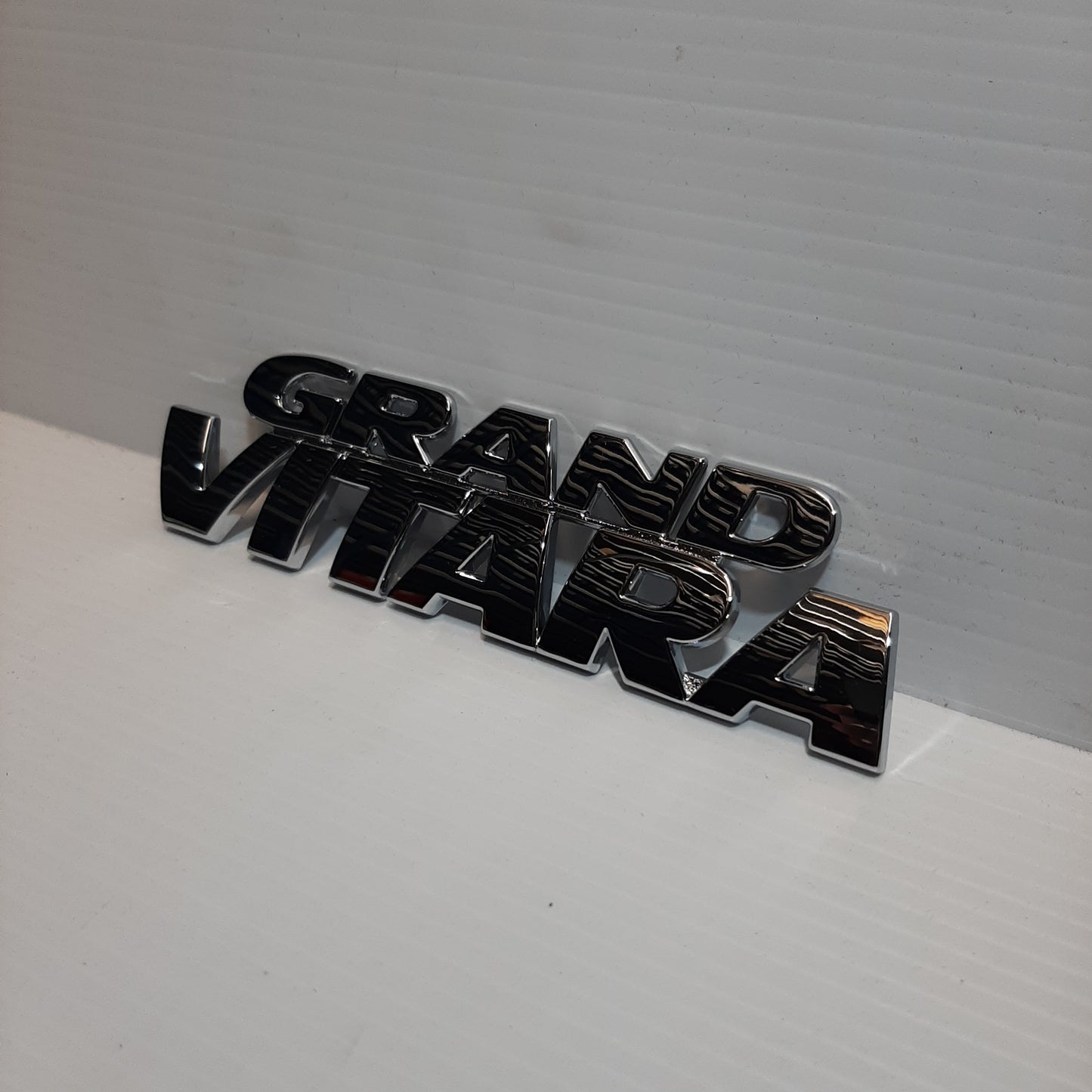 Genuine Emblem Grand Vitara - Suzuki Grand Vitara | 77841-65D21-0PG